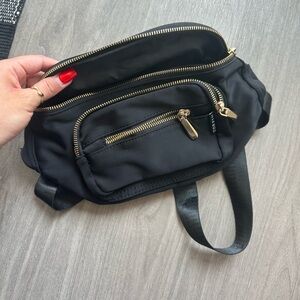 Black Fanny pack, gold accents.